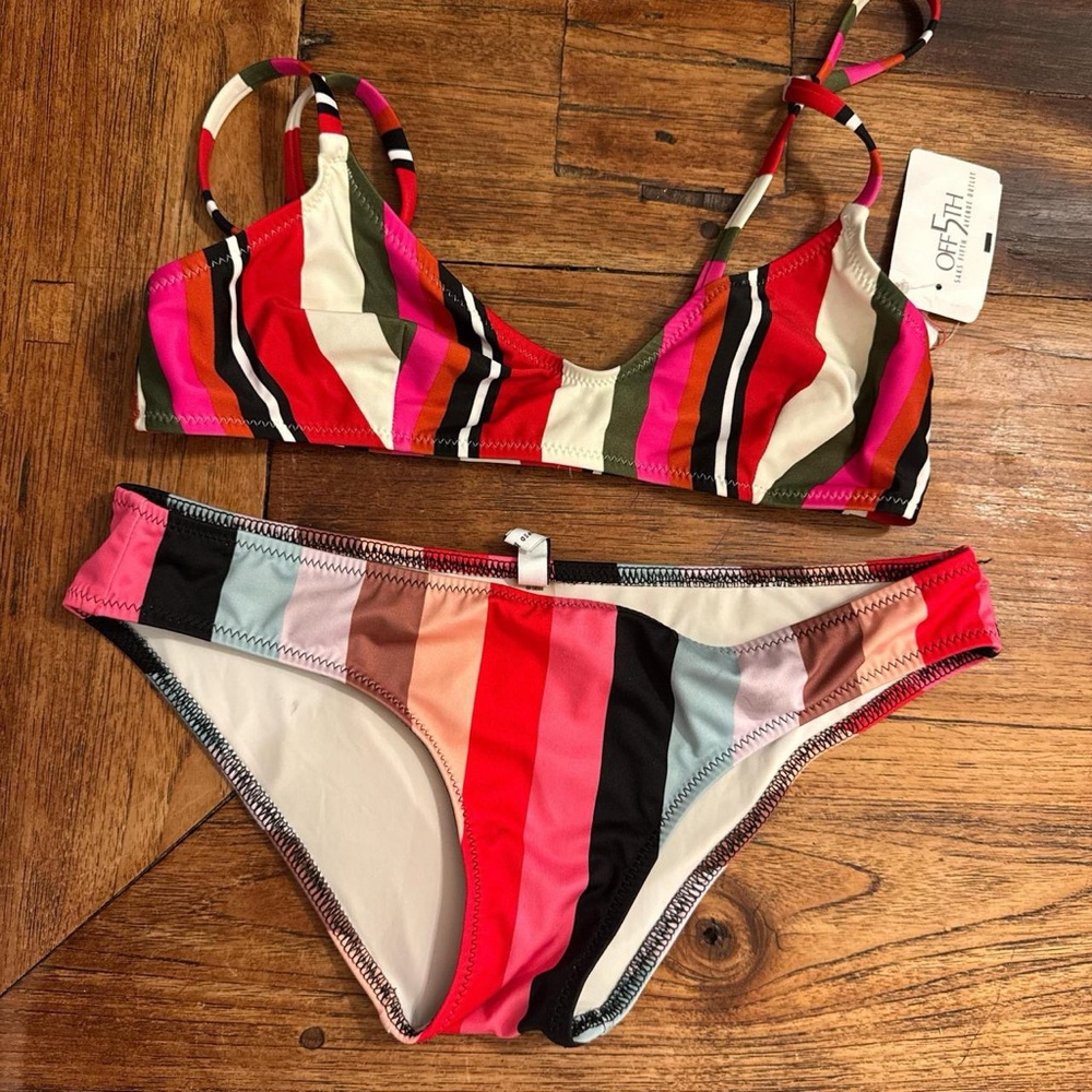 Solid and striped bikini top and bottoms size small 
Top runs small